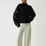 Nina ribstrikket sweater med høj hals fra Elsebeth København, set bagfra